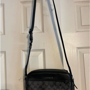 Coach NWT black and charcoal.  6x91/2, adjustable 50 in strap.